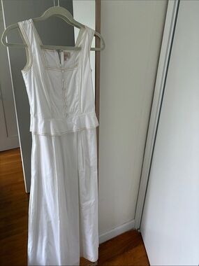 Sleeveless White Peplum Maxi Dress with Button-Front Bodice